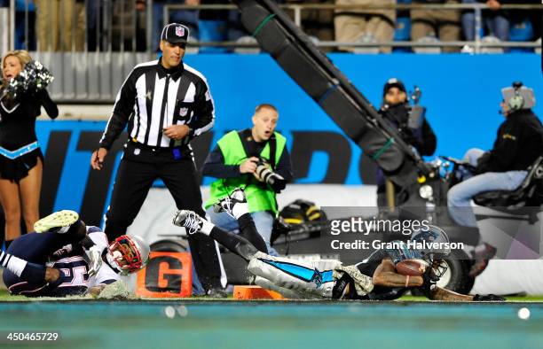 Ted Ginn Jr. #19 of the Carolina Panthers scores a touchdown against Logan Ryan of the New England Patriots late in the fourth quarter at Bank of...