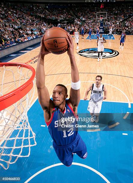 Evan Turner of the Philadelphia 76ers flies in for the dunk against the Dallas Mavericks on November 18, 2013 at the American Airlines Center in...