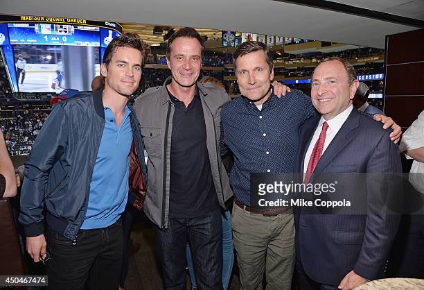 Actors Matt Bomer, Tim DeKay, Stephen B. Burke, and Commissioner of the National Hockey League Gary Bettman attend game four of the 2014 NHL Stanley...