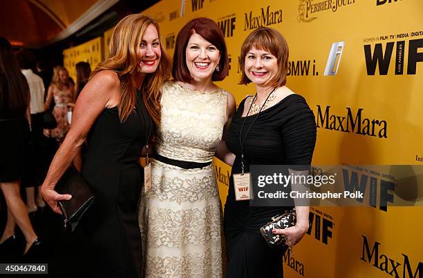Actress Kate Flannery with Women In Film auction winners Natalie Brekke and Nadia Semczuk attend Women In Film 2014 Crystal + Lucy Awards presented...