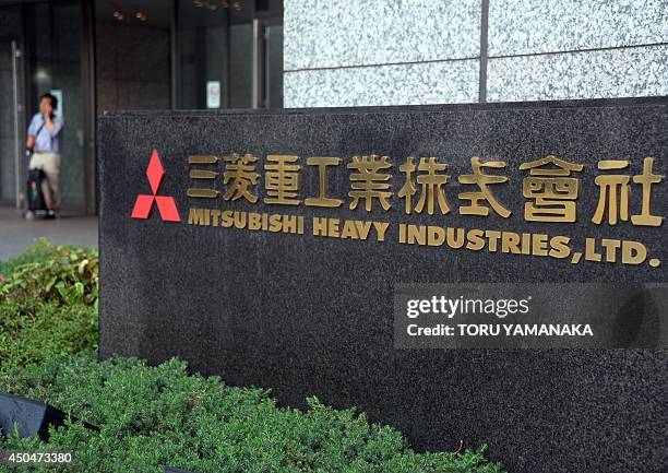 The logo outside the headquarters of Japan corporation Mitsubishi Heavy Industries is pictured in Tokyo on June 12, 2014. Mitsubishi Heavy Industries...
