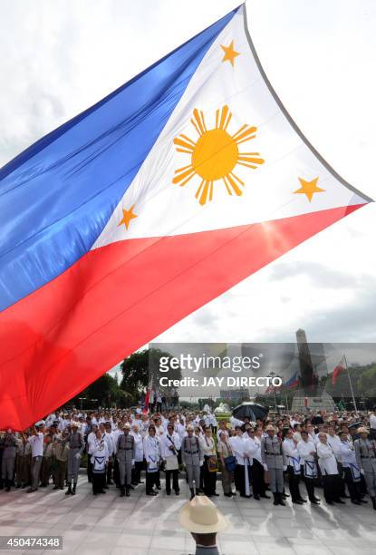 The Philippines national flag is raised in Manila on June 12, 2014 as the Southeast Asian archipelago celebrates the 116th anniversary of its...