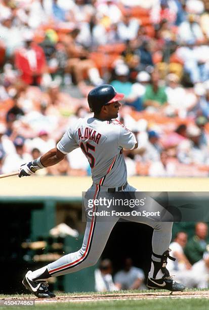 Sandy Alomar Jr of the Cleveland Indians bats against the Oakland Athletics during an Major League Baseball game circa 1990 at the Oakland-Alameda...