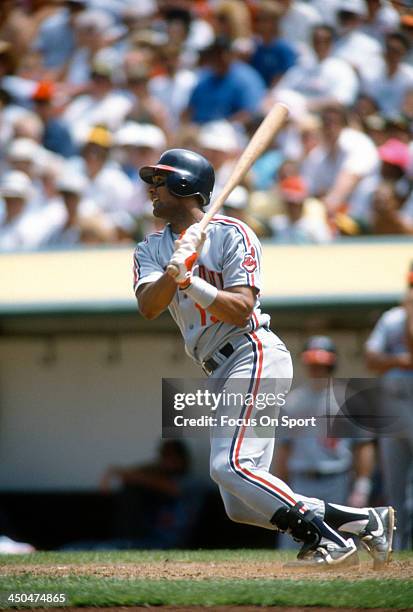 Sandy Alomar Jr of the Cleveland Indians bats against the Oakland Athletics during an Major League Baseball game circa 1990 at the Oakland-Alameda...