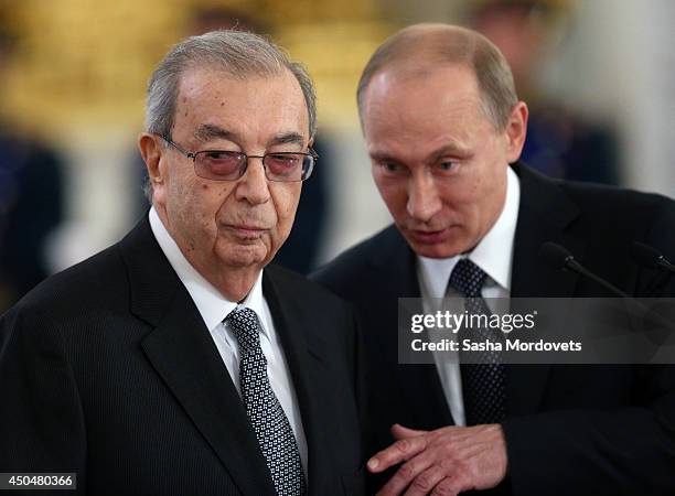 Russian President Vladimir Putin and Former Prime Minister Yevgeny Primakov are seen during the State Awards Ceremony during celebration of the Day...