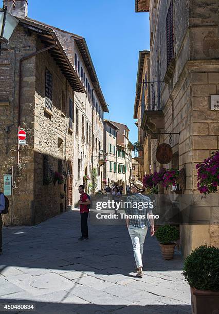 Tourist walking through the streets of Pienza on May 24 in Pienza, Italy.