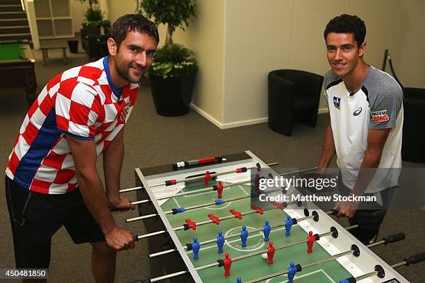 Tennis players Marin Cilic of Croatia and Andre Sa of Brazil have a game of table football in the players lounge on day four of the Aegon...