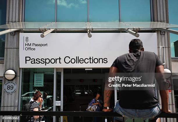 Man waits outside the passport office collections office on June 12, 2014 in London, England. Home Secretary Theresa May has announced extra measures...