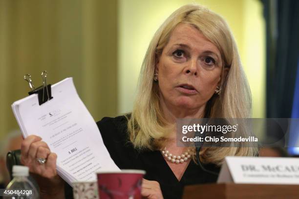 The Committee to Reduce Infection Deaths Chairman Betsy McCaughey holds up a copy of proposed legislation while testifying before the House Veterans'...