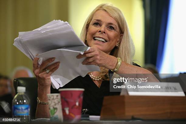 The Committee to Reduce Infection Deaths Chairman Betsy McCaughey holds up a copy of what she said is union contract while testifying before the...