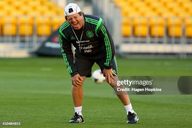 Coach Miguel Herrera of Mexico enjoys a laugh during a Mexico training session and press conference at Westpac Stadium on November 19, 2013 in...