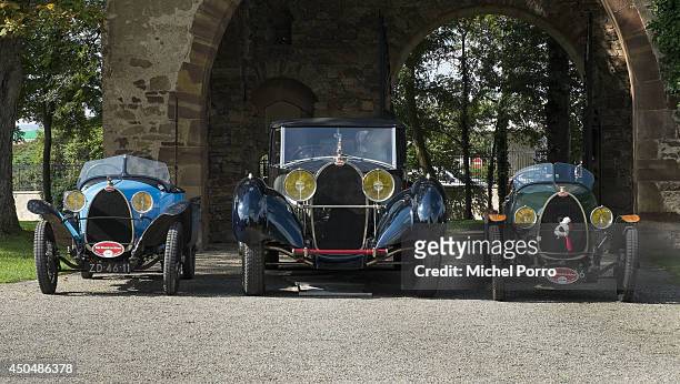 Bugatti type Brescia cars stand beside the most exclusive and most expensive Bugatti Royale at Chateau Saint Jean, the head office of Bugatti, during...
