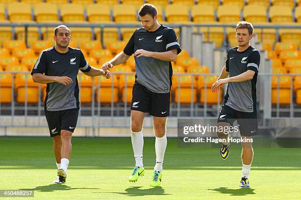 To R, Leo Bertos, Tommy Smith and Michael McGlinchey of New Zealand warm up during a New Zealand All Whites training session at Westpac Stadium on...