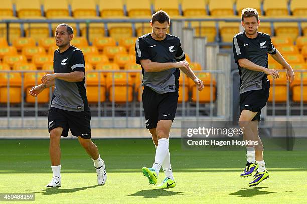 To R, Leo Bertos, Tommy Smith and Michael McGlinchey of New Zealand warm up during a New Zealand All Whites training session at Westpac Stadium on...