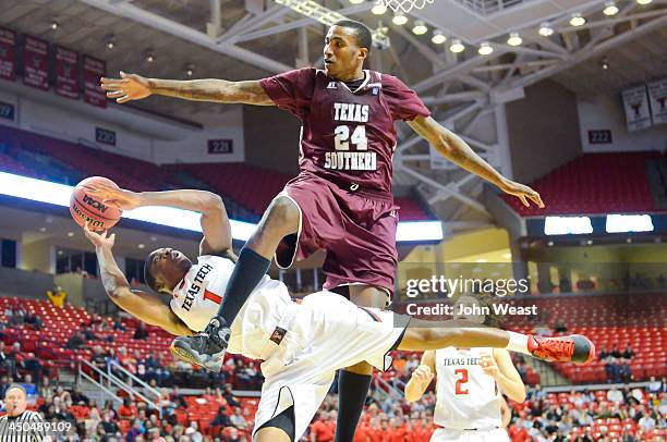 Randy Onwuasor of the Texas Tech Red Raiders is fouled by Christian McCoggle of the Texas Southern Tigers during game action on November 18, 2013 at...