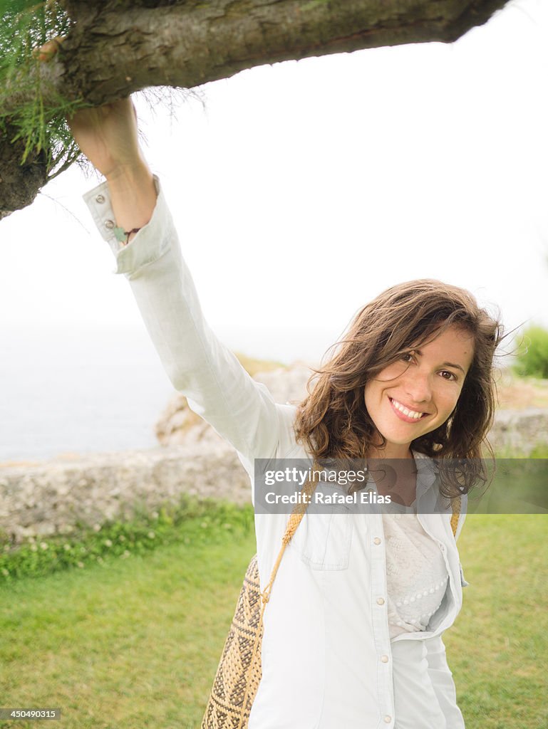 Pretty woman under tree