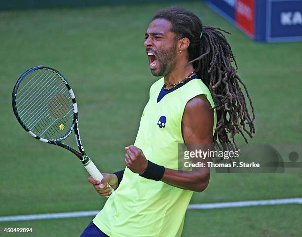 Dustin Brown of Germany celebrates in his match against Rafael Nadal of Spain during day four of the Gerry Weber Open at Gerry Weber Stadium on June...