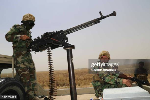 Kurdish Peshmerga forces and Iraqi special forces deploy their troops and armoured vehicles outside of the oil-rich city of Kirkuk, Iraq on June 12,...