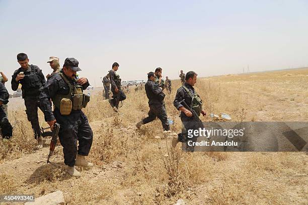 Kurdish Peshmerga forces and Iraqi special forces deploy their troops outside of the oil-rich city of Kirkuk, Iraq on June 12, 2014. The hardline...