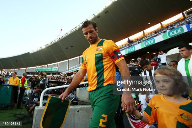 Socceroos captain Lucas Neill leads his team onto the feild during the international friendly match between the Australian Socceroos and Costa Rica...