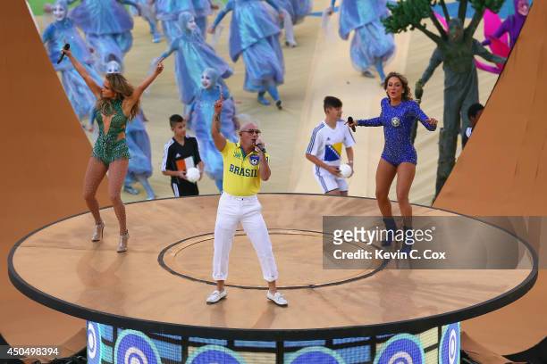 Singers Jennifer Lopez, Pitbull and Claudia Leitte perform during the Opening Ceremony of the 2014 FIFA World Cup Brazil prior to the Group A match...