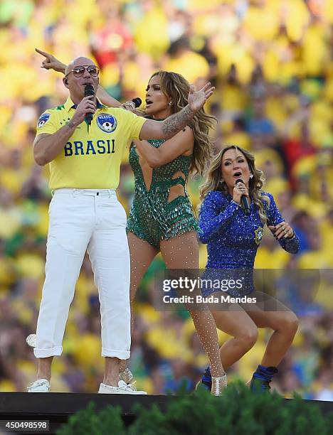Performers Pitbull, Jennifer Lopez and Claudia Leitte perform during the Opening Ceremony of the 2014 FIFA World Cup Brazil prior to the Group A...