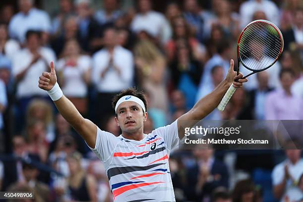 Marinko Matosevic of Australia celebrates after defeating Jo-Wilfried Tsonga of France during their Men's Singles match on day four of the Aegon...