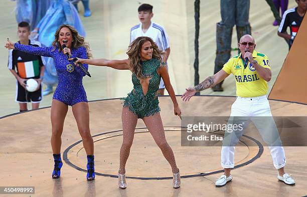 Singers Claudia Leitte, Jennifer Lopez and Pitbull perform during the Opening Ceremony of the 2014 FIFA World Cup Brazil prior to the Group A match...
