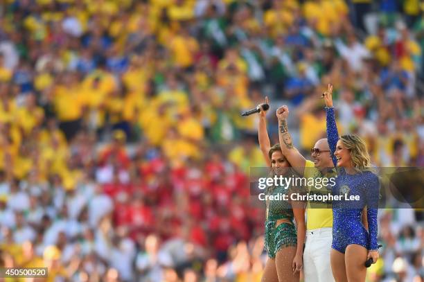 Singers Jennifer Lopez, Pitbull and Claudia Leitte perform during the Opening Ceremony of the 2014 FIFA World Cup Brazil prior to the Group A match...