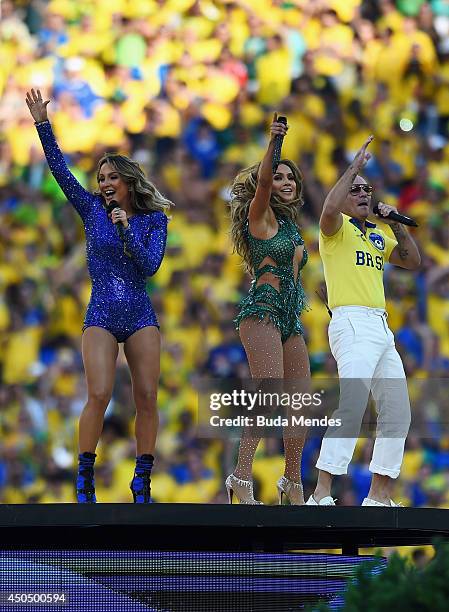 Singers Claudia Leitte, Jennifer Lopez and Pitbull perform during the Opening Ceremony of the 2014 FIFA World Cup Brazil prior to the Group A match...