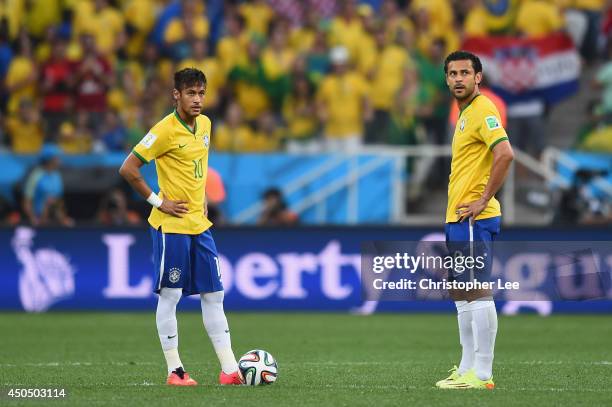 Neymar and Fred of Brazil wait to kick off in the first half during the 2014 FIFA World Cup Brazil Group A match between Brazil and Croatia at Arena...