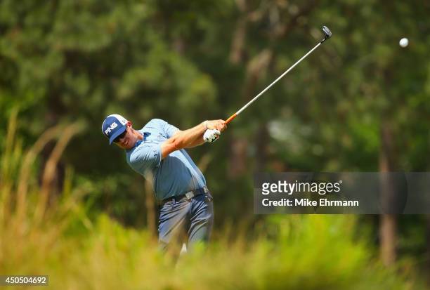 Hunter Mahan of the United States hits a tee shot on the seventh hole during the first round of the 114th U.S. Open at Pinehurst Resort & Country...