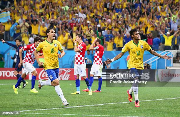 Neymar of Brazil celebrates his second goal with Hernanes in the second half during the 2014 FIFA World Cup Brazil Group A match between Brazil and...