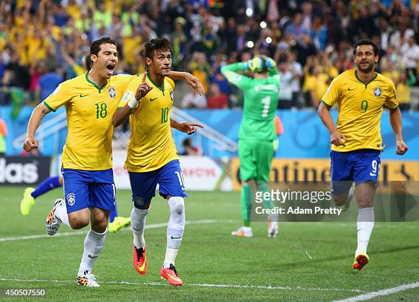 Neymar of Brazil celebrates his second goal with Hernanes in the second half during the 2014 FIFA World Cup Brazil Group A match between Brazil and...