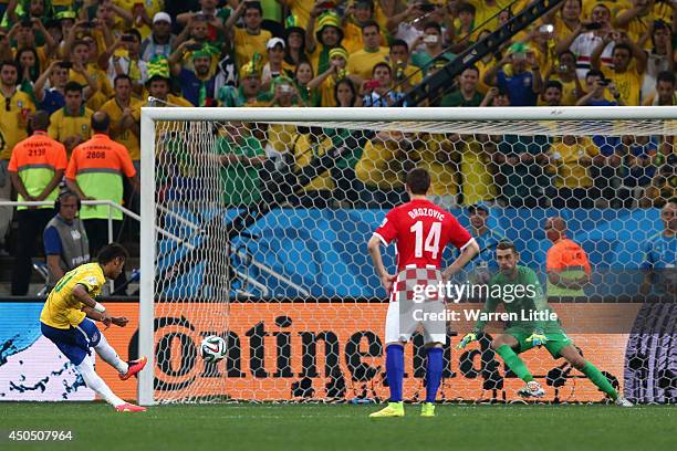 Neymar of Brazil takes a penalty kick against Stipe Pletikosa of Croatia as Marcelo Brozovic looks on during the 2014 FIFA World Cup Brazil Group A...