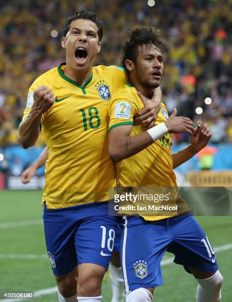 Neymar JR celebrates scoring a penalty with Hernanes during the opening match of the 2014 World Cup between Brazil and Croatia at Arena de Sao Paulo...