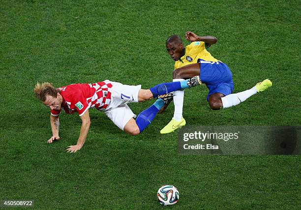 Ivan Rakitic of Croatia and Ramires of Brazil fall after a challenge during the 2014 FIFA World Cup Brazil Group A match between Brazil and Croatia...