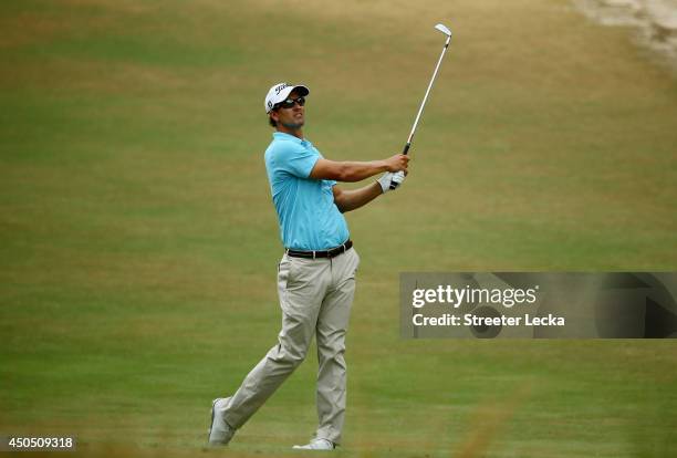 Adam Scott of Australia hits an approach shot on the eighth hole during the first round of the 114th U.S. Open at Pinehurst Resort & Country Club,...