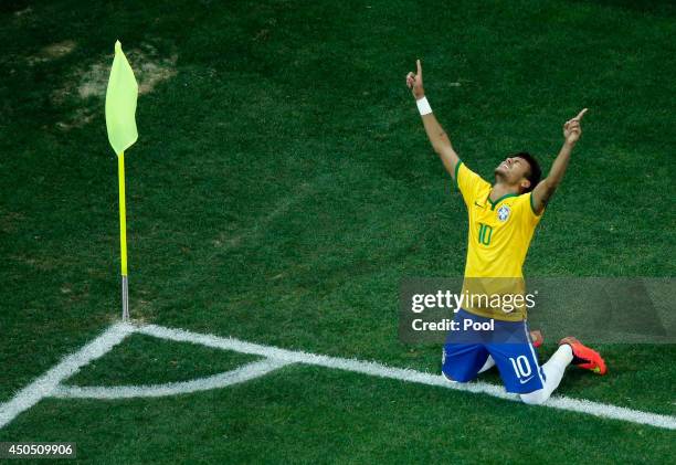 Neymar of Brazil celebrates scoring his second goal on a penalty kick in the second half during the 2014 FIFA World Cup Brazil Group A match between...