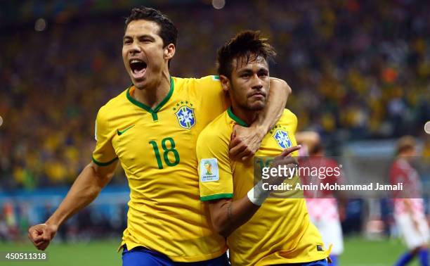 Hernanes and Neymar of Brazil celebrat scoring his second goal on a penalty kick in the second half during the 2014 FIFA World Cup Brazil Group A...