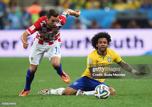 Darijo Srna of Croatia and Marcelo of Brazil compete for the ball during the 2014 FIFA World Cup Brazil Group A match between Brazil and Croatia at...