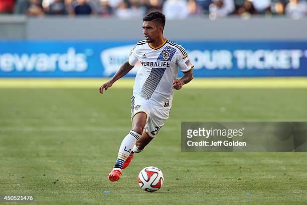 DeLaGarza of the Los Angeles Galaxy dribbles the ball while airborne against the Philadelphia Union in the second half of the MLS match at StubHub...