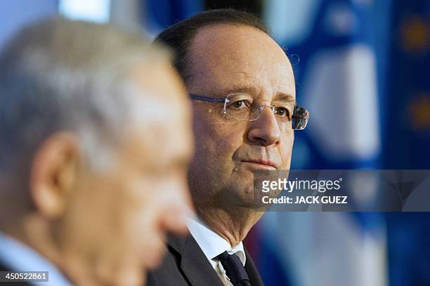 French President Francois Hollande is pictured next to Israeli Prime Minister Benjamin Netanyahu during their visit to a French-Israeli technology...