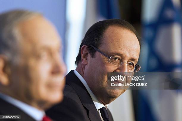 French President Francois Hollande smiles during his visit with Israeli Prime Minister Benjamin Netanyahu his counterpart Shimon Peres to a...