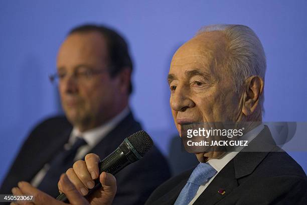 Israeli President Shimon Peres addresses a French-Israeli technology innovation summit at a hotel in the Mediterranean coastal city of Tel Aviv on...