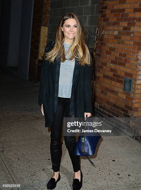 Elizabeth Olsen leaves 'The Daily Show With Jon Stewart' on November 18, 2013 in New York City.