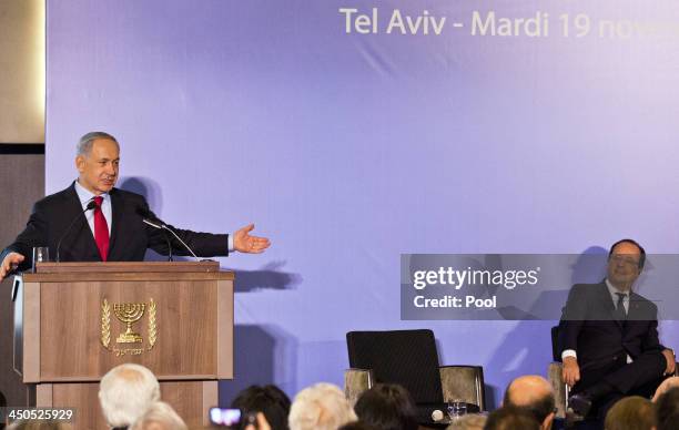 French President Francois Hollande , listens to a speech by Israeli Prime Minister Benjamin Netanyahu at a French-Israeli technology innovation...