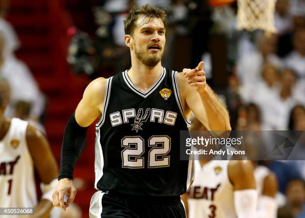 Tiago Splitter of the San Antonio Spurs reacts against the Miami Heat during Game Four of the 2014 NBA Finals at American Airlines Arena on June 12,...