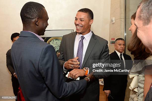 Olympic athlete Ryan Bailey and David Rudisha attend the adidas Grand Prix celebration hosted by OMEGA at the OMEGA Fifth Avenue Boutique on June 12,...