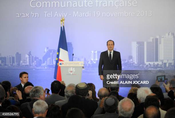 French President Francois Hollande recites the national anthem during a meeting with the French comunity, in Tel Aviv on November 19, 2013. Hollande...